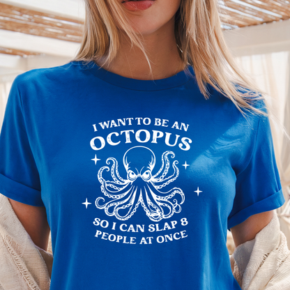 Person wearing a royal blue t-shirt with an octopus graphic and text.