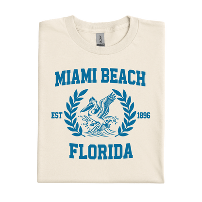 Folded t-shirt with 'Miami Beach Florida' text and graphic on a white background