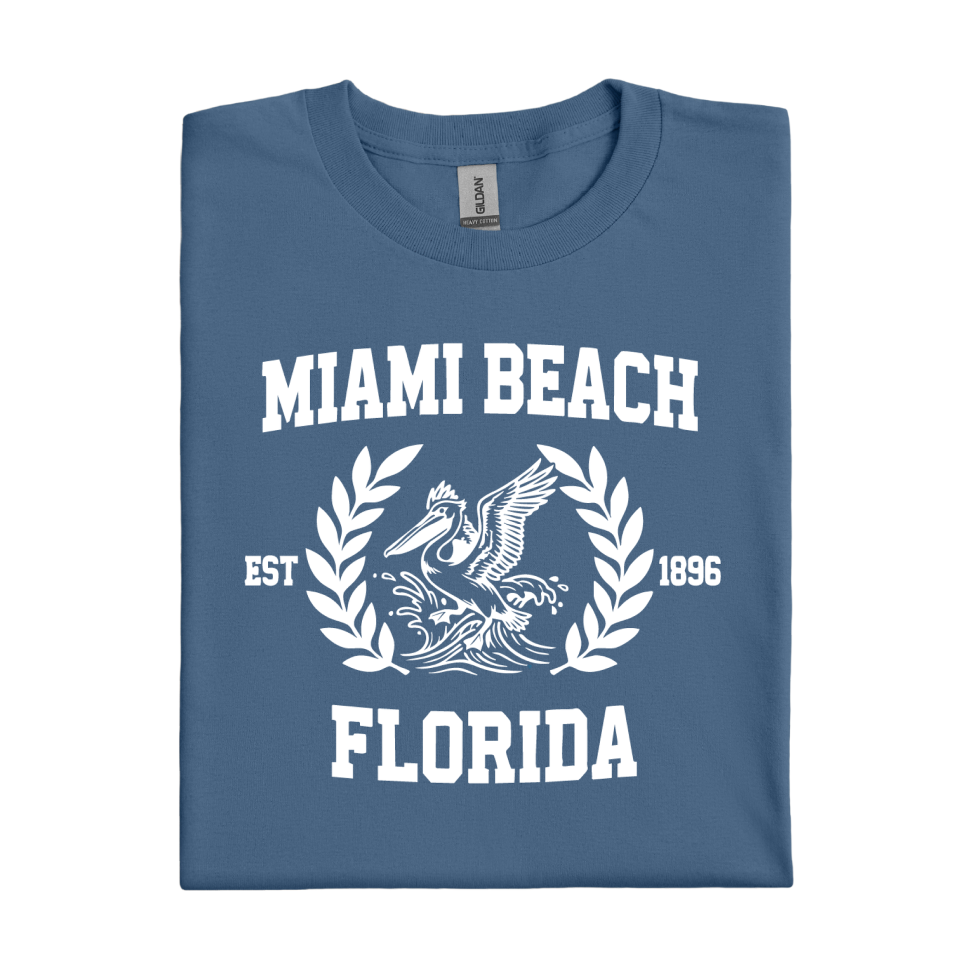 Folded indigo blue t-shirt with 'Miami Beach Florida' text and graphic on a white background