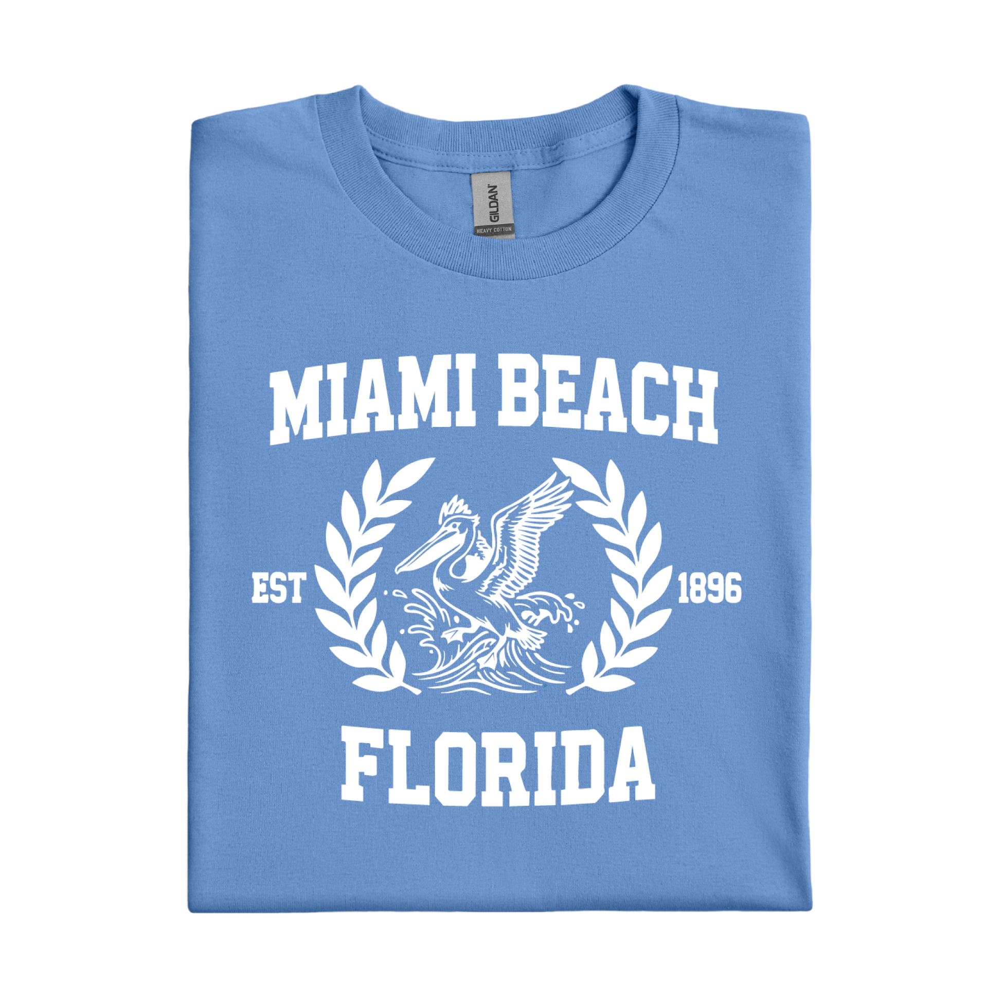 Folded Carolina blue t-shirt with 'Miami Beach Florida' text and pelican design on a white background