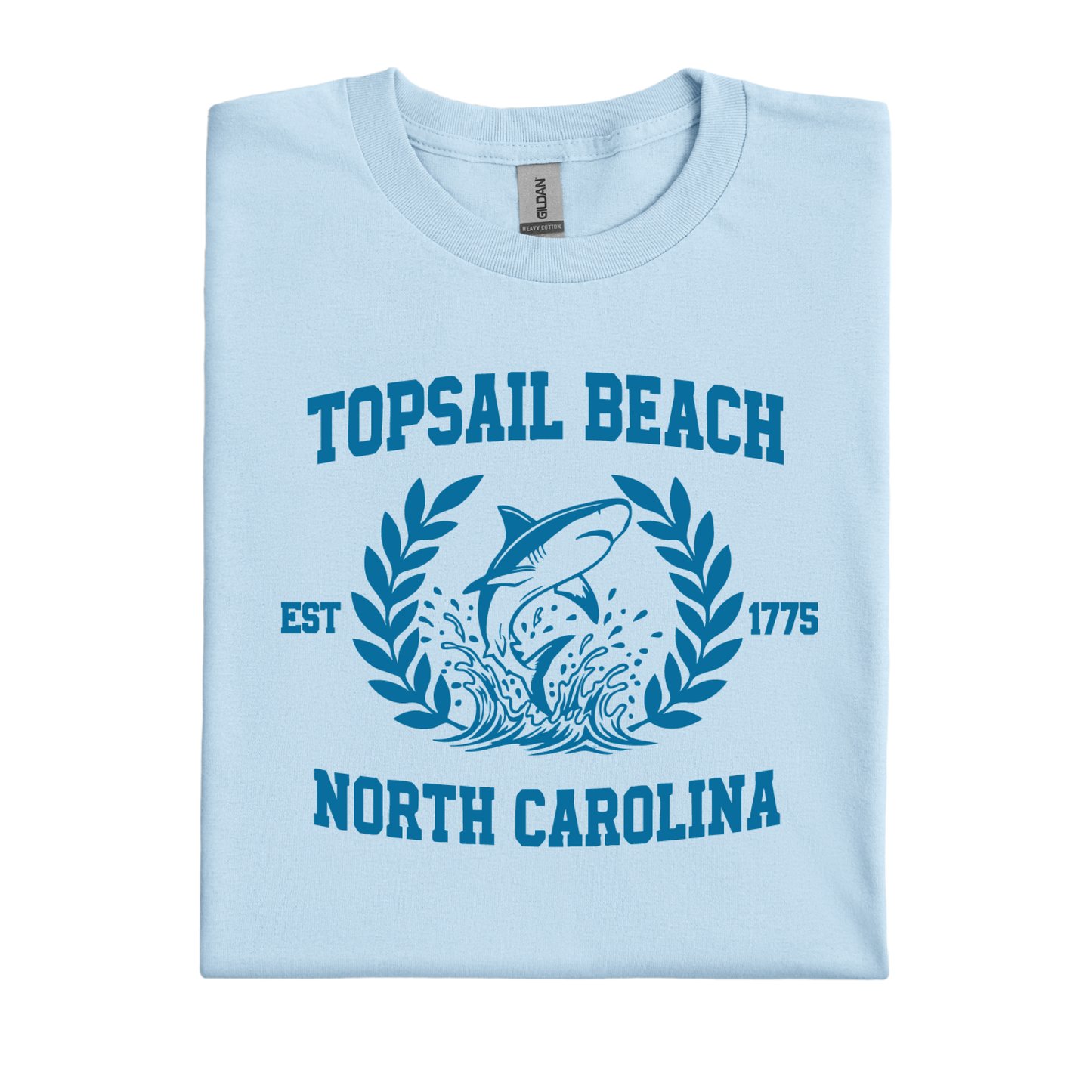 Light blue t-shirt with shark graphic and text on a white background