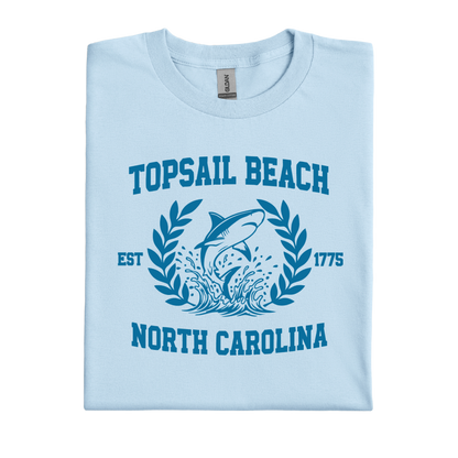 Light blue t-shirt with shark graphic and text on a white background