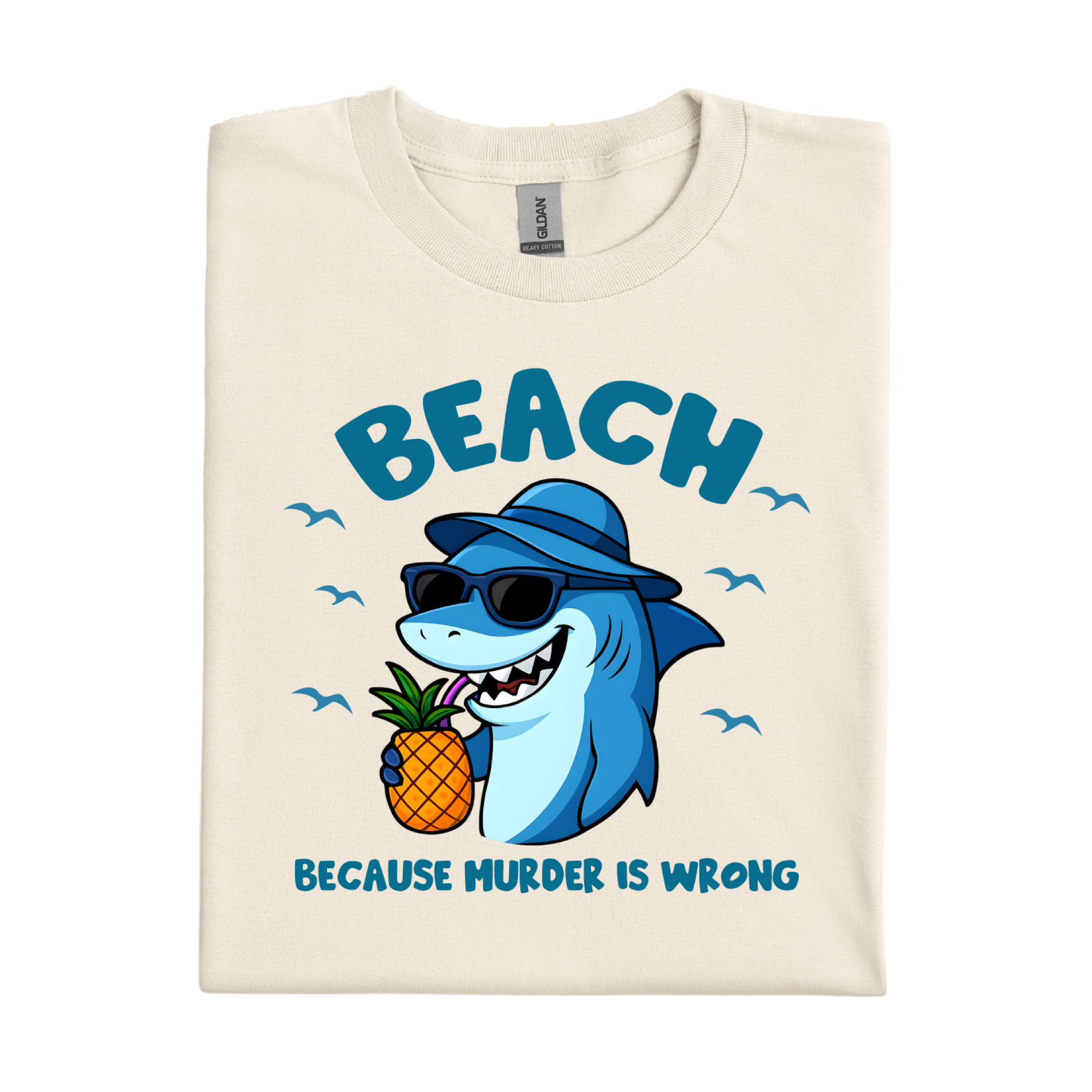 Beach-themed t-shirt with a cartoon shark holding a pineapple and text on a white background