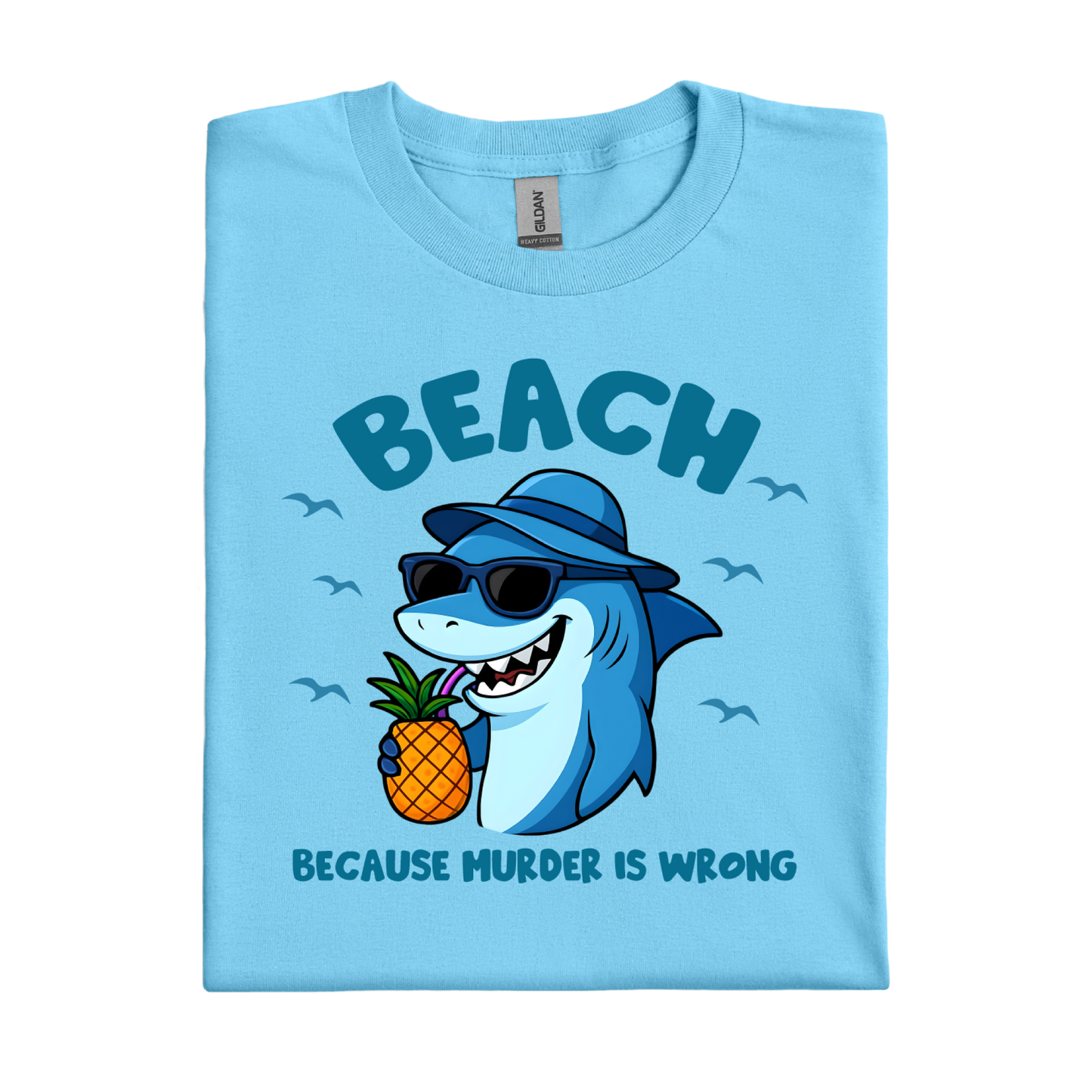Sky blue t-shirt with a shark holding a pineapple and text on a white background