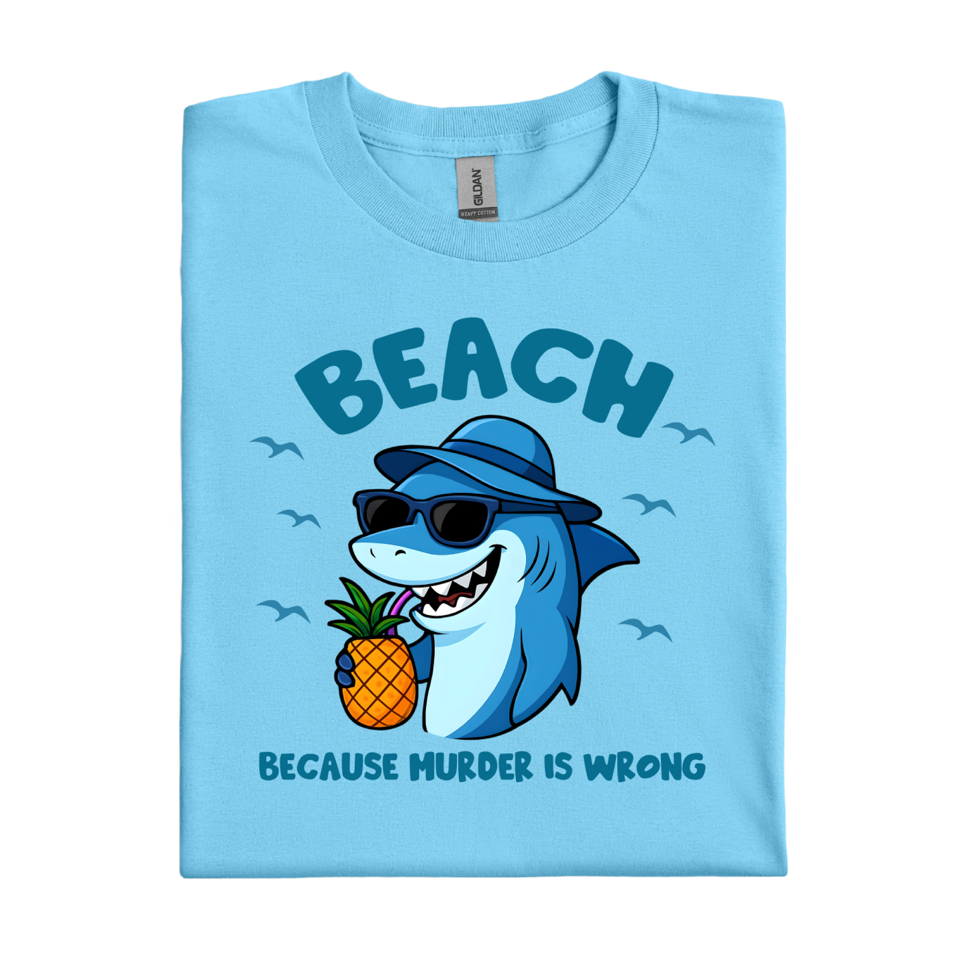 Sky blue t-shirt with a shark holding a pineapple and text on a white background