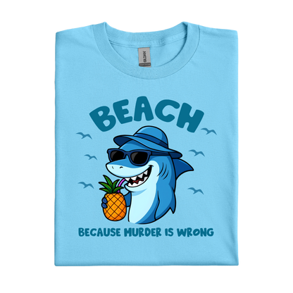 Sky blue t-shirt with a shark holding a pineapple and text on a white background