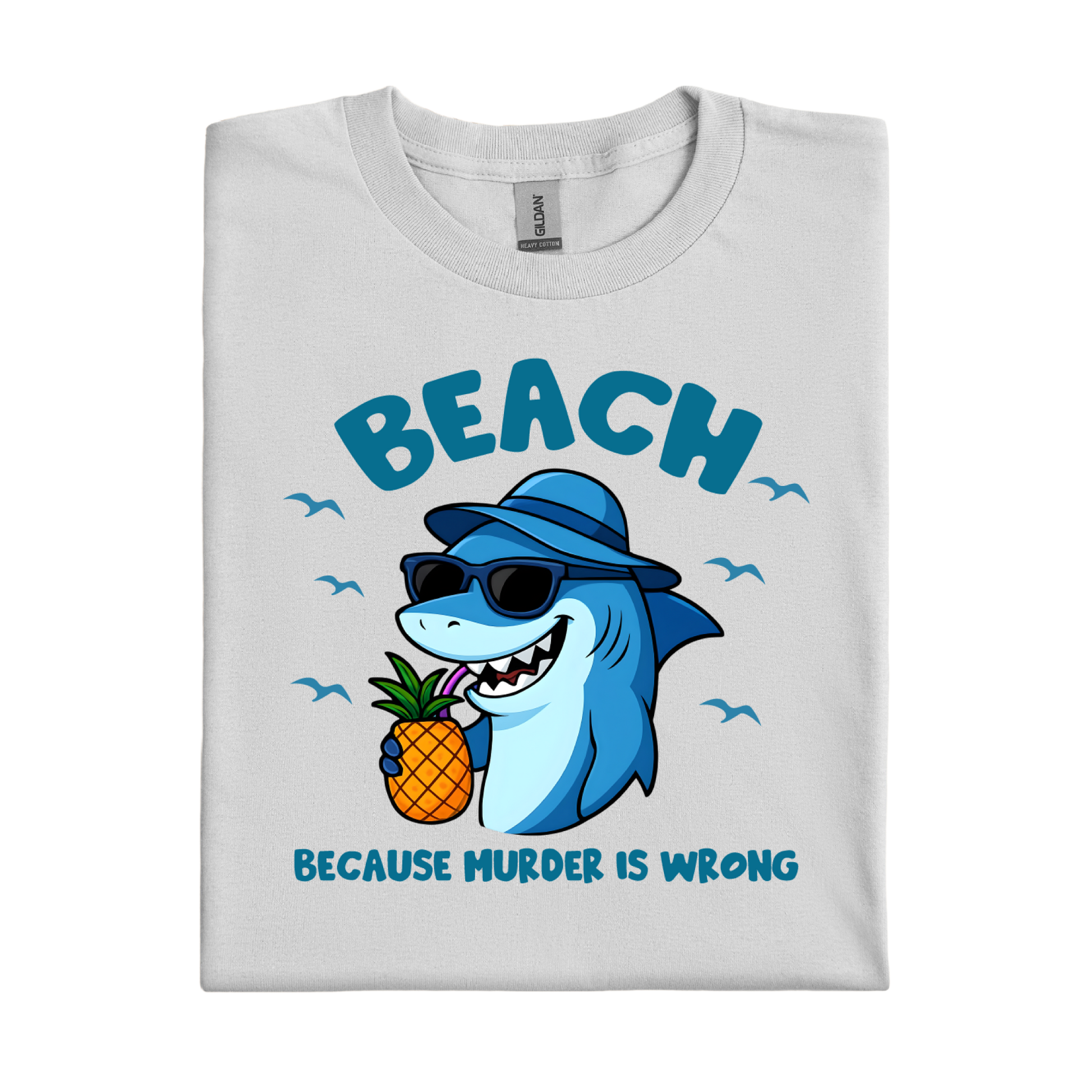 Folded t-shirt with a shark holding a pineapple and text on a white background