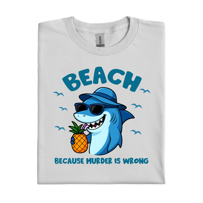 Folded t-shirt with a shark holding a pineapple and text on a white background