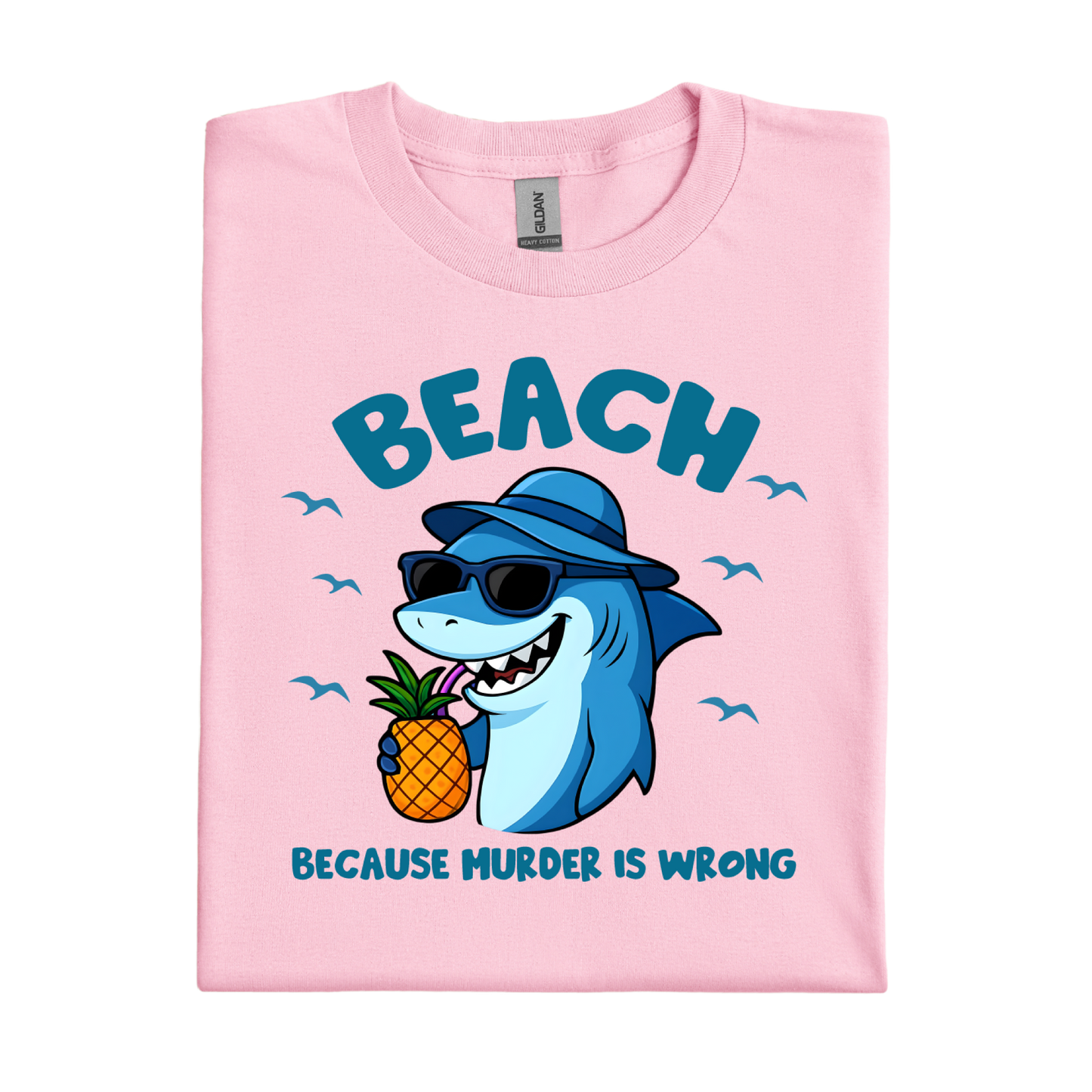 Light Pink t-shirt with a shark holding a pineapple and text on a white background