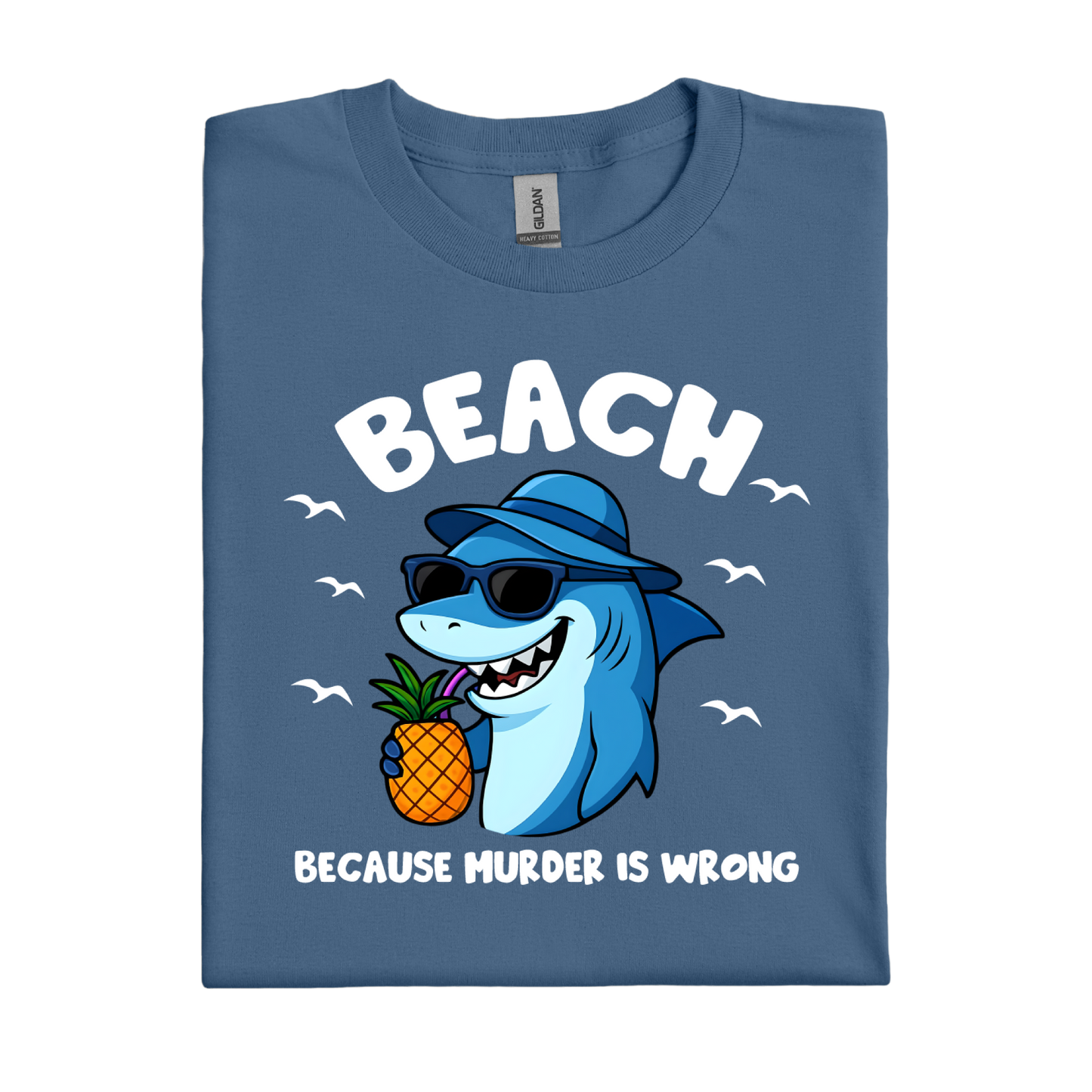 Indigo Blue t-shirt with a shark holding a pineapple and text on a white background