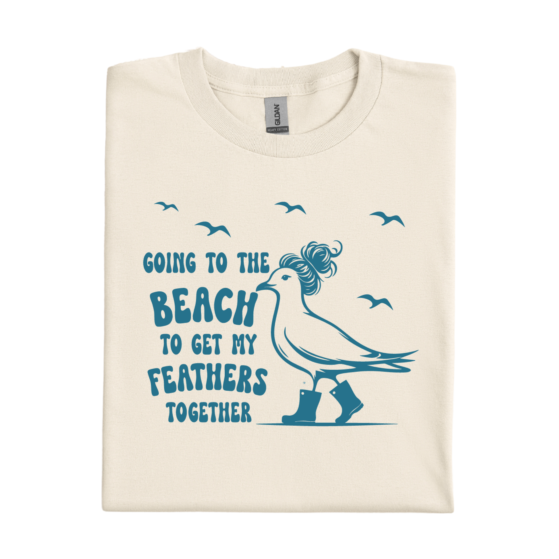 Natural t-shirt with a graphic of a bird and text 'Going to the beach to get my feathers together' on a white background.