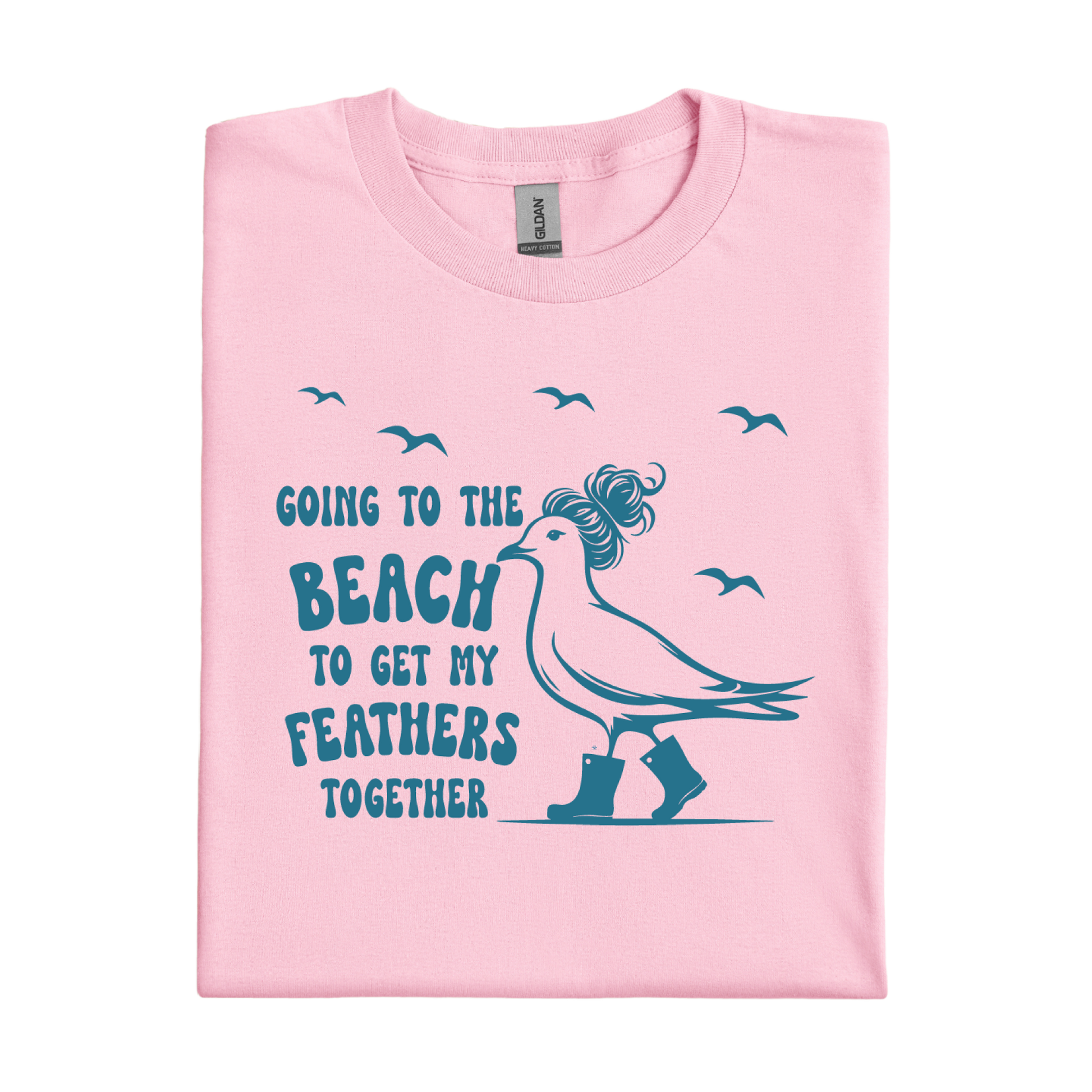 Light Pink t-shirt with a graphic of a bird and text 'Going to the beach to get my feathers together' on a white background.