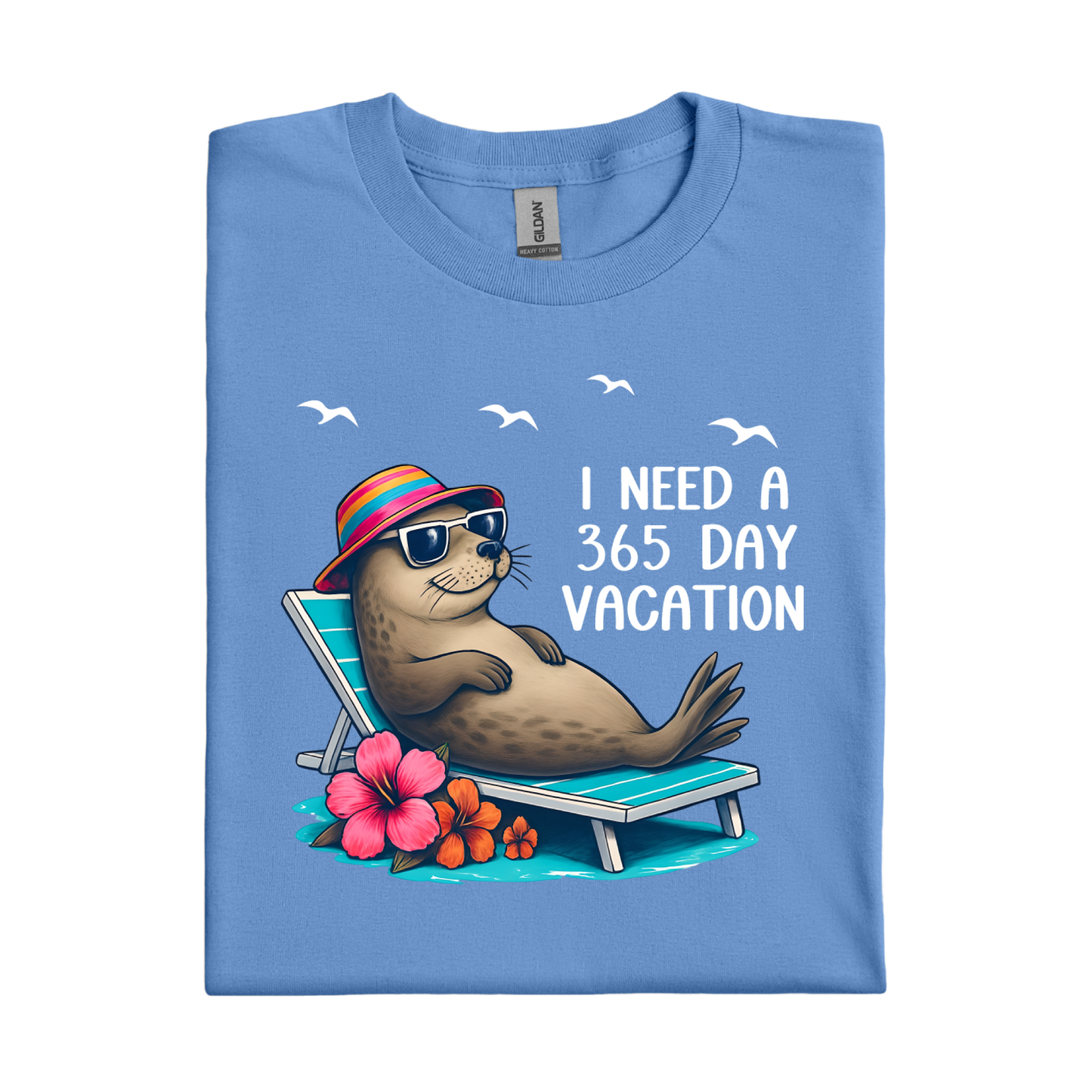 Folded Carolina blue t-shirt with a seal graphic and text on a white background