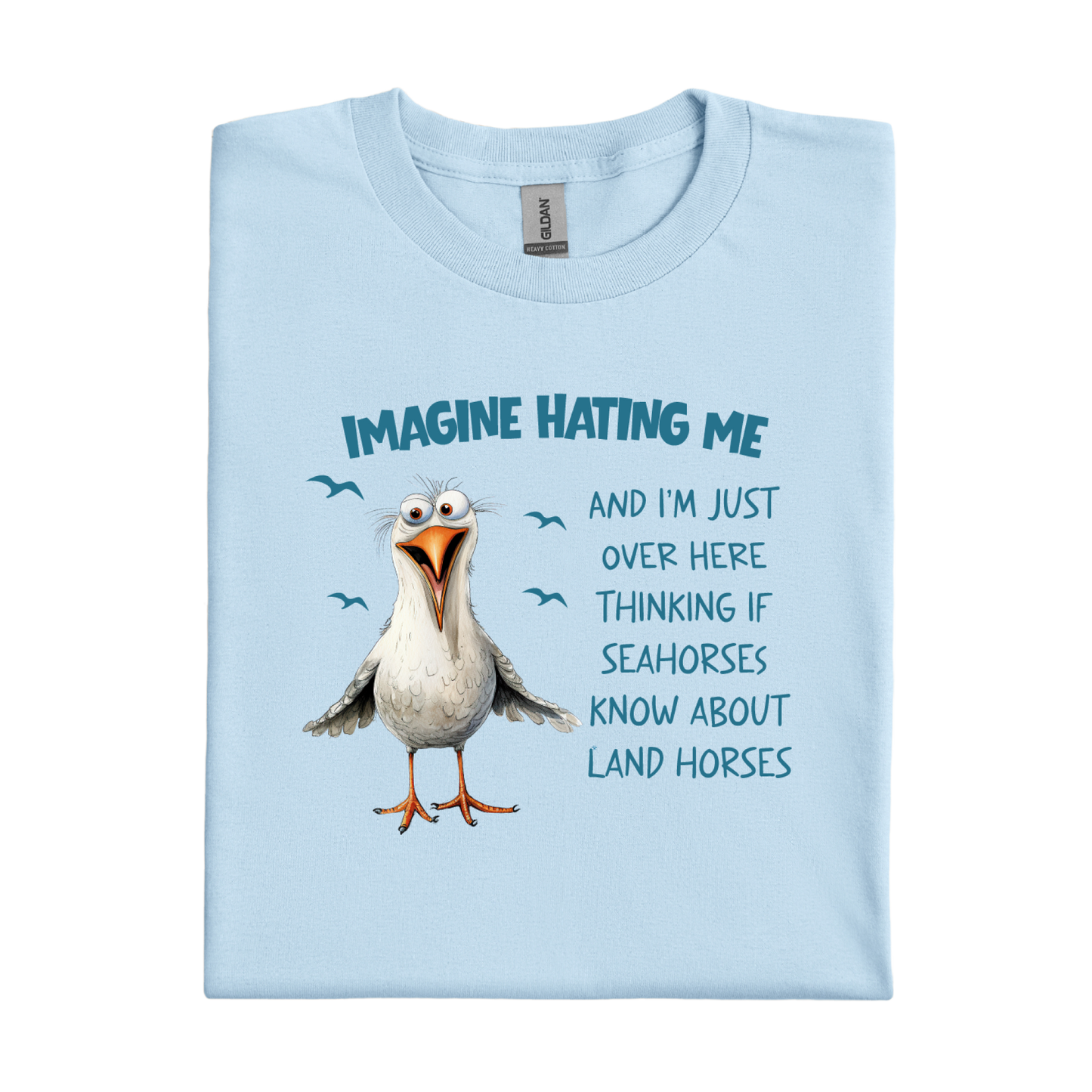 Light blue t-shirt with a cartoon seagull and humorous text on a white background