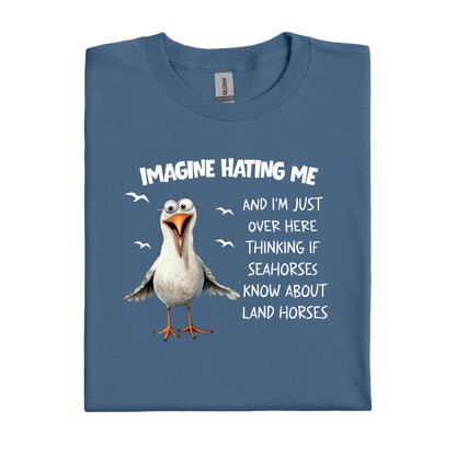 Indigo Blue t-shirt with a cartoon seagull and humorous text on a white background