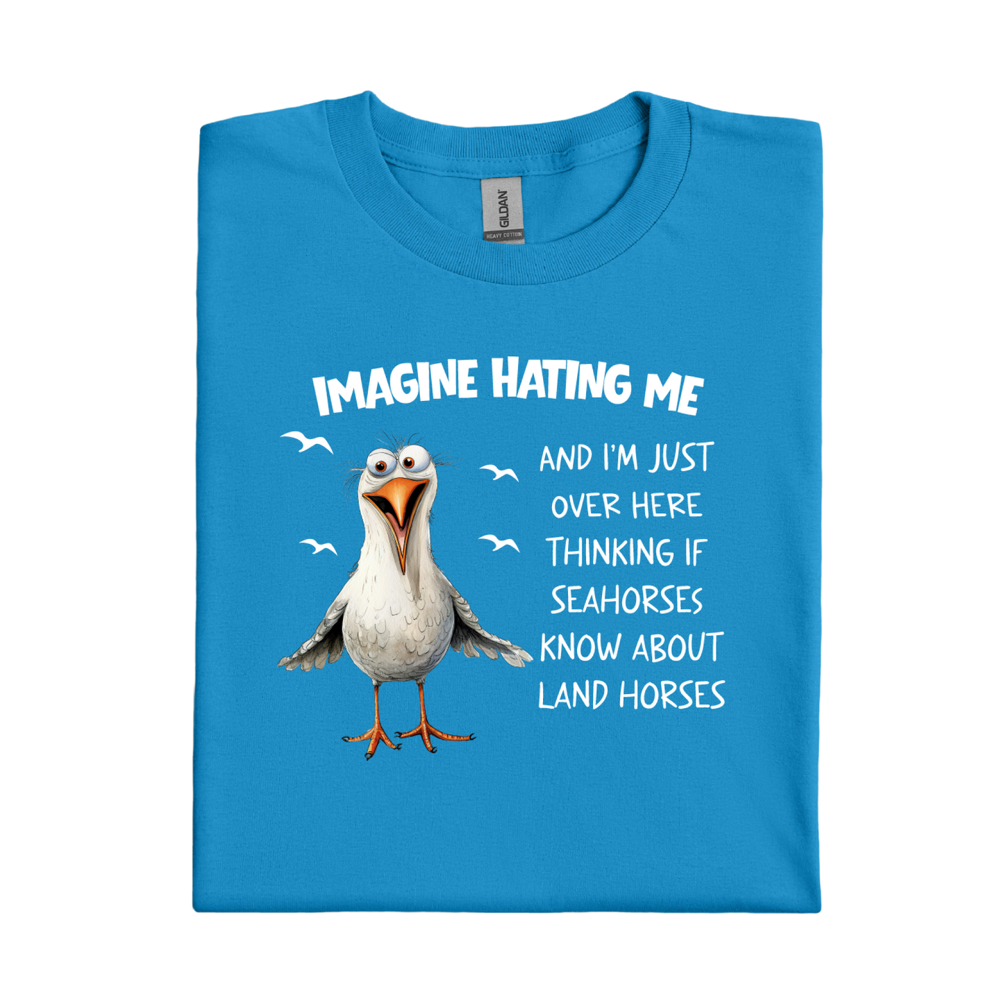 Sapphire Blue t-shirt with a cartoon seagull and humorous text on a white background