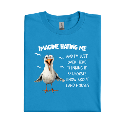 Sapphire Blue t-shirt with a cartoon seagull and humorous text on a white background