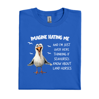 Royal Blue t-shirt with a cartoon seagull and humorous text on a white background