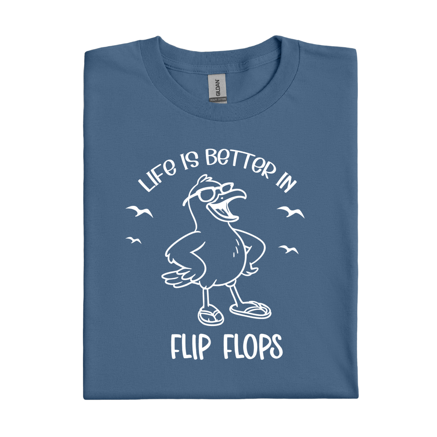 Folded indigo blue t-shirt with a seagull graphic and text on a white background