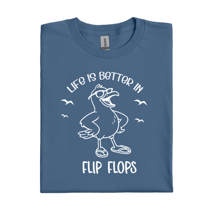 Folded indigo blue t-shirt with a seagull graphic and text on a white background