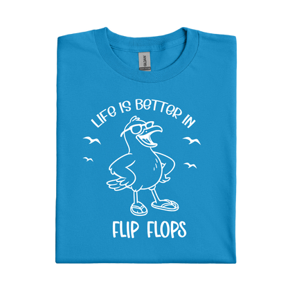 Sapphire Blue t-shirt with a cartoon seagull and text 'Life is better in flip flops' on a white background