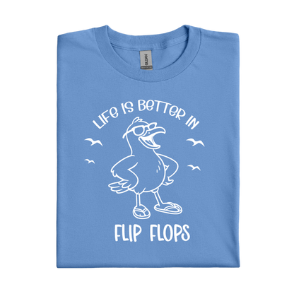 Carolina Blue t-shirt with a cartoon seagull and text 'Life is better in flip flops' on a white background