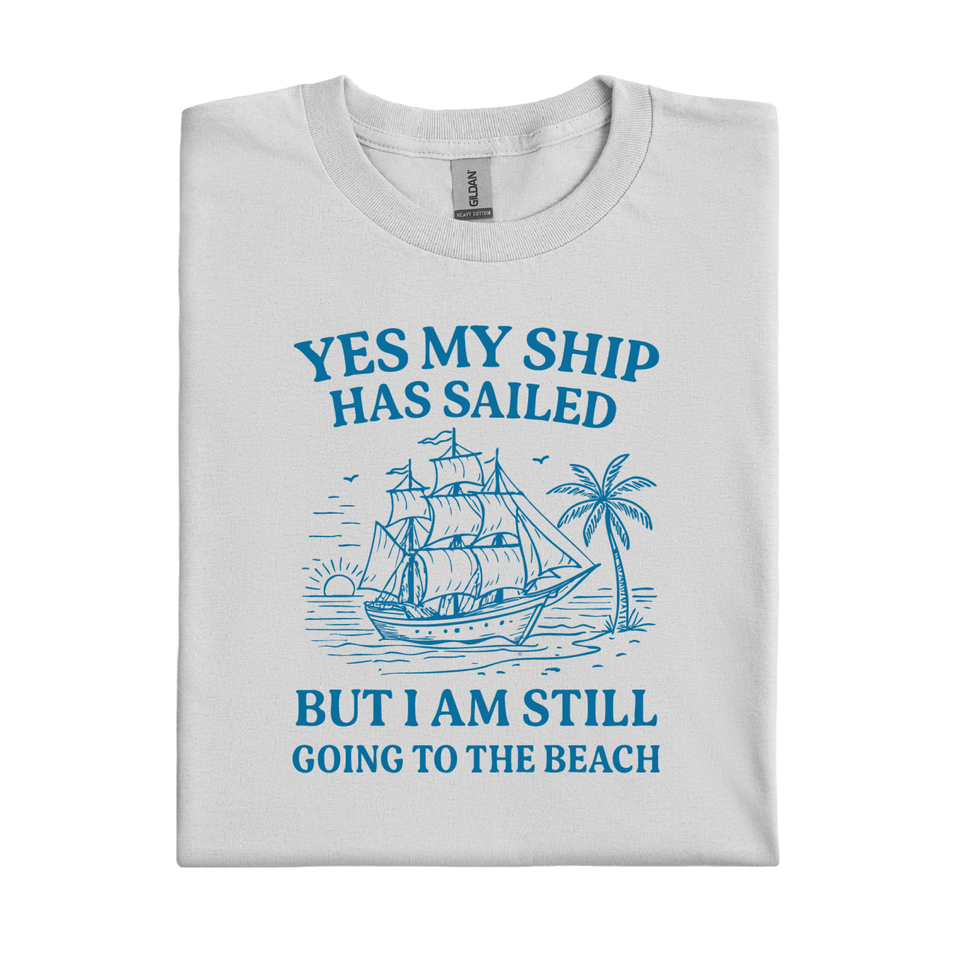Folded t-shirt with blue ship and beach graphic and text on a white background