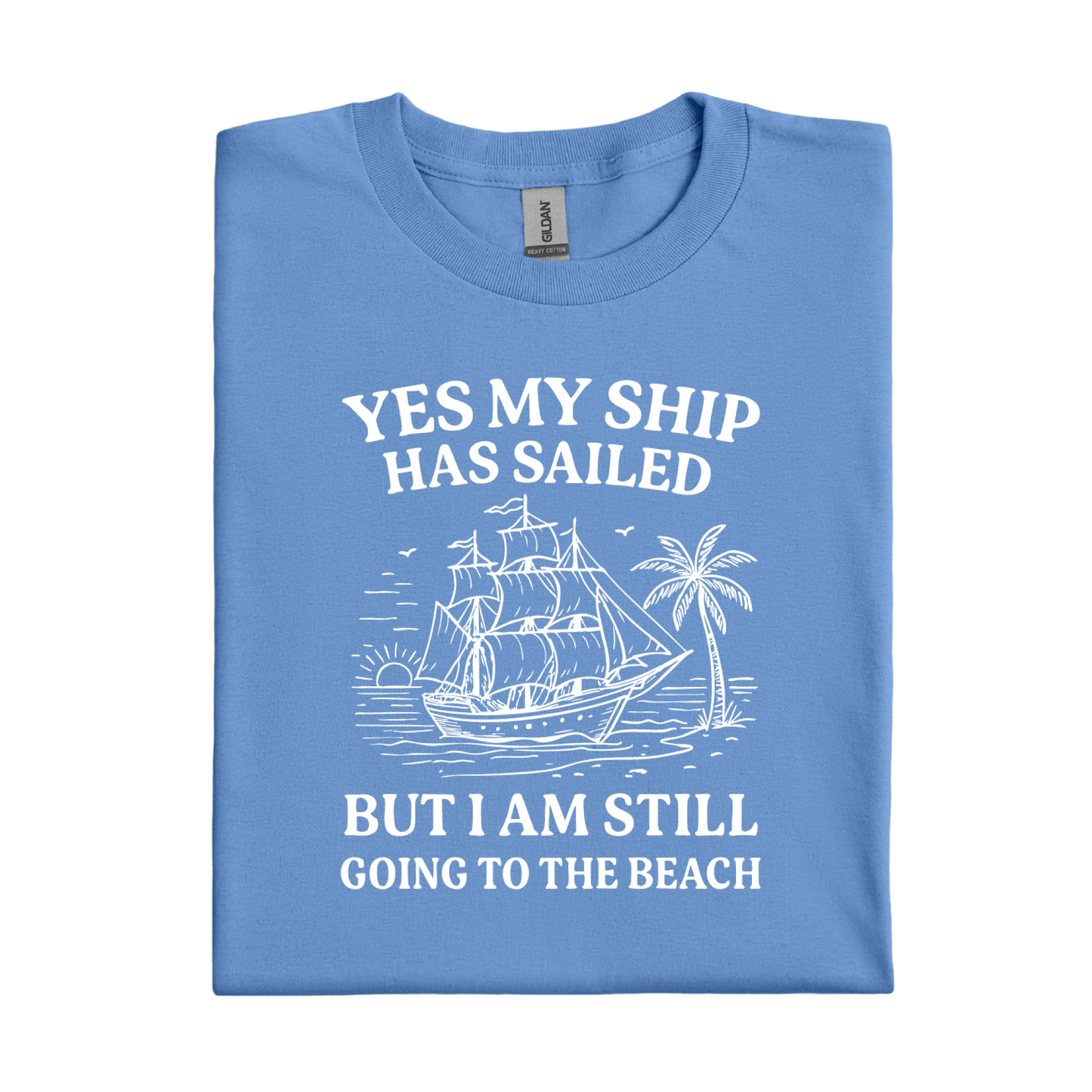 Carolina Blue t-shirt with white graphic and text 'YES MY SHIP HAS SAILED BUT I AM STILL GOING TO THE BEACH' on a white background