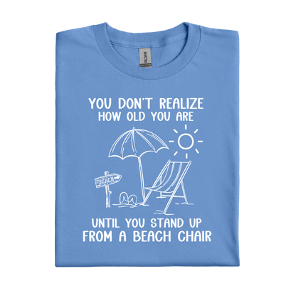 Carolina Blue t-shirt with beach-themed design and text on a white background