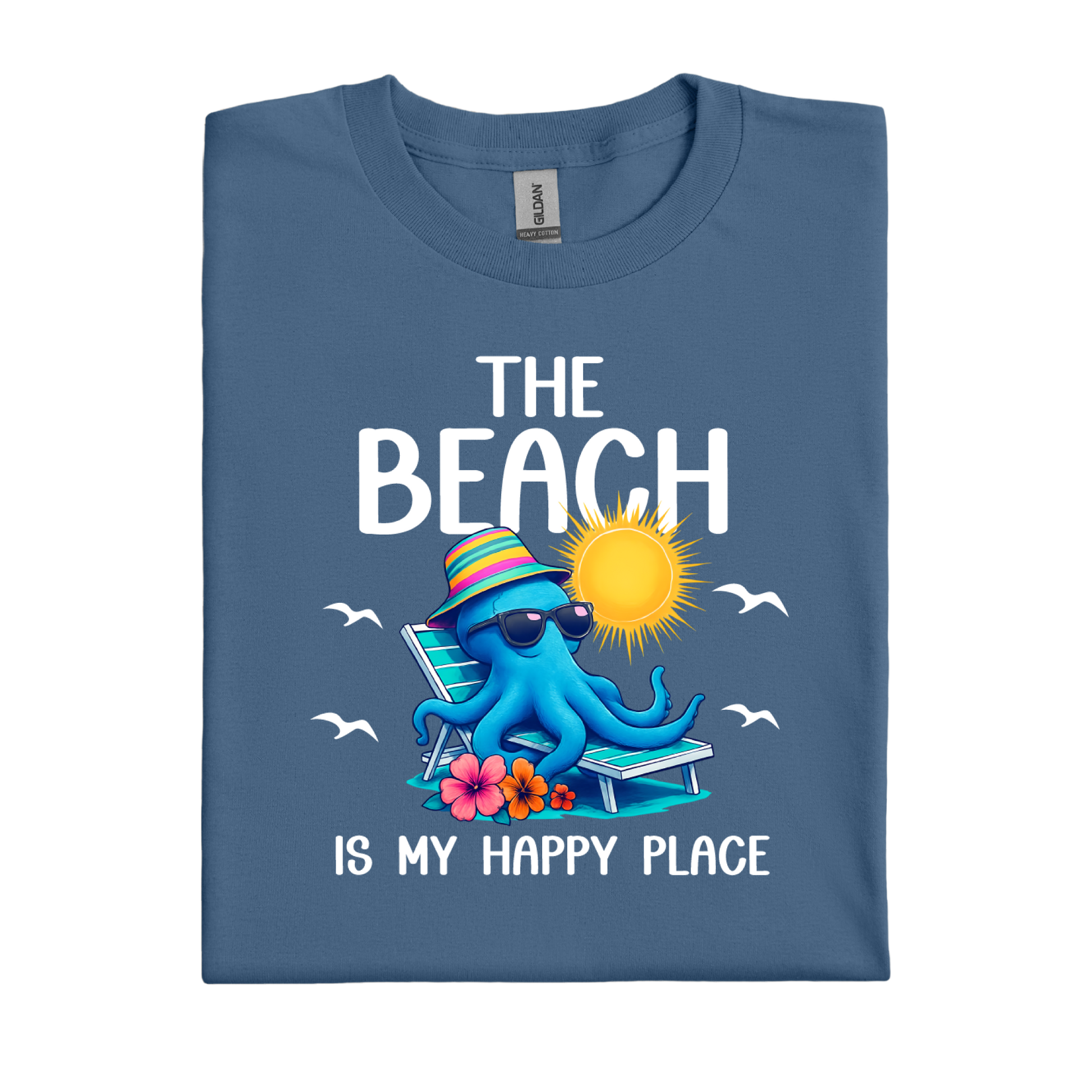 Folded indigo blue t-shirt with an octopus graphic and beach-themed text on a white background