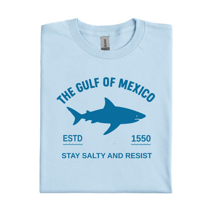 Light blue t-shirt with shark graphic and text on a white background