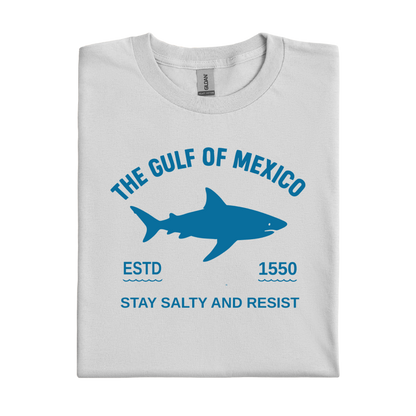 Folded t-shirt with a shark graphic and text on a white background