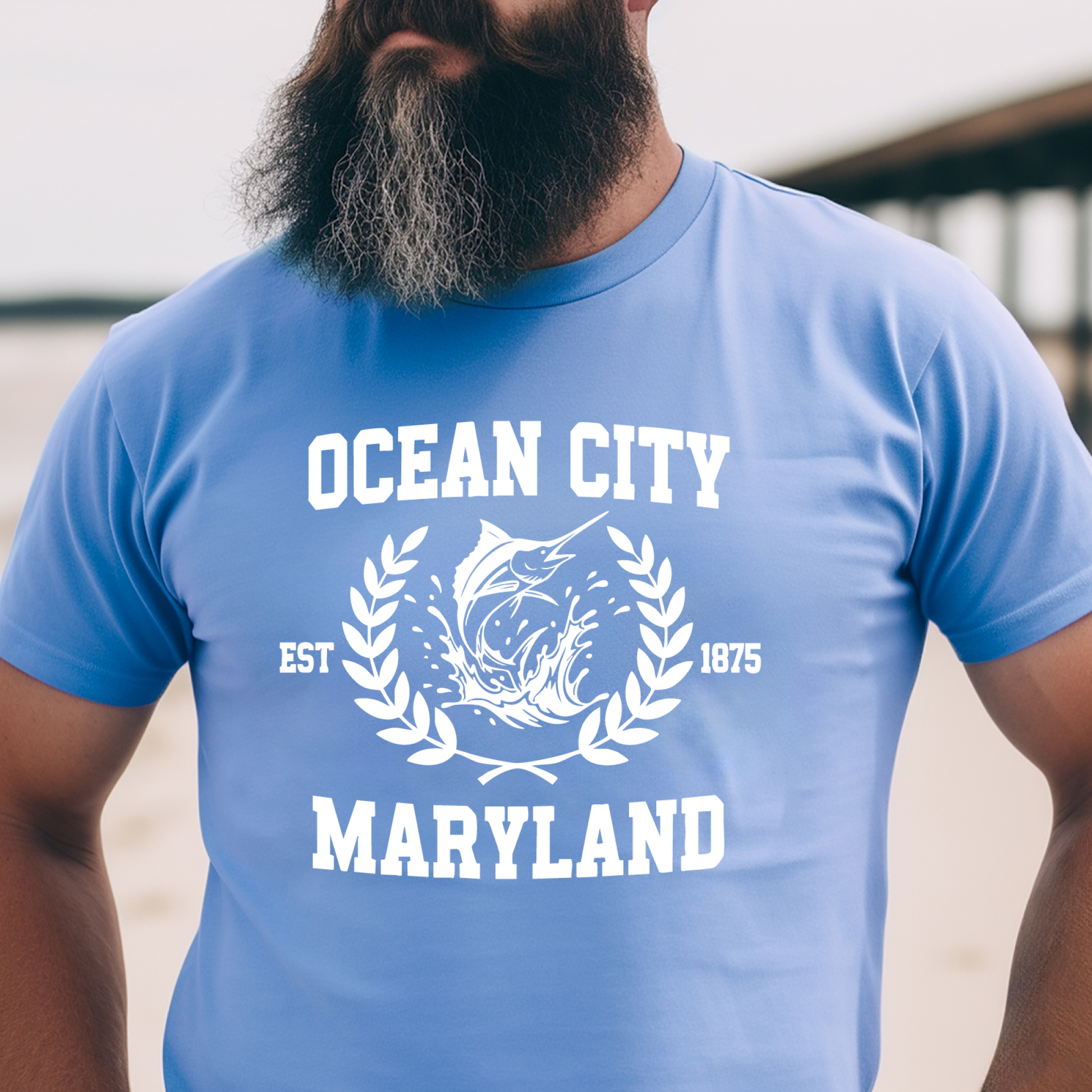 Person wearing a Carolina blue t-shirt with 'Ocean City, Maryland' printed on it.