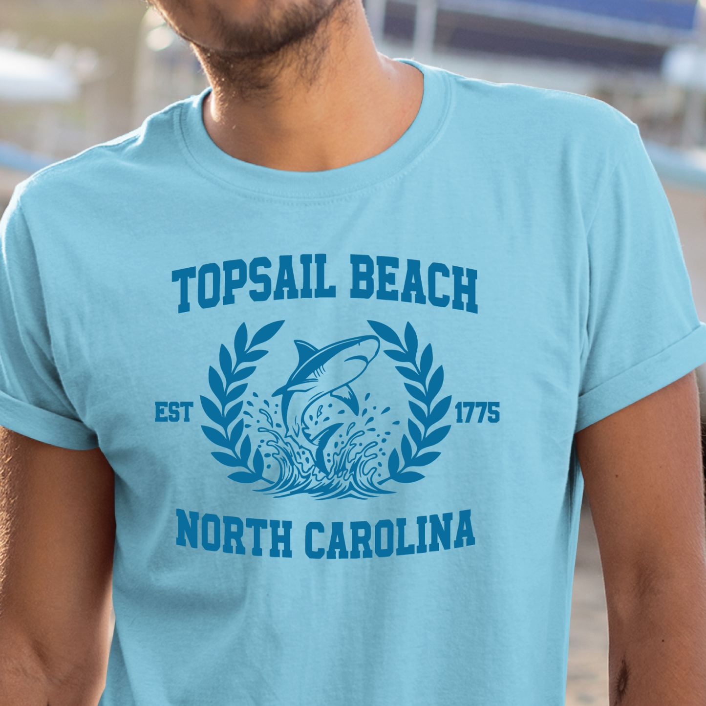 Sky blue t-shirt with 'Topsail Beach, North Carolina' design featuring a dolphin and waves.