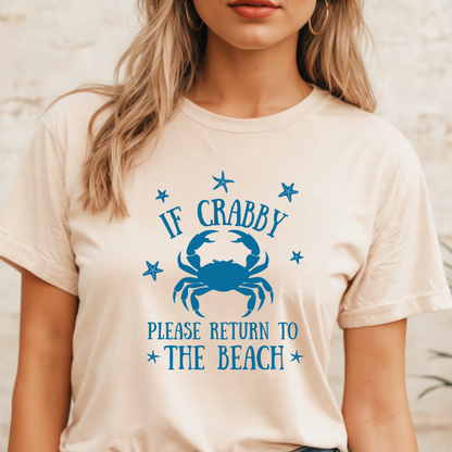 Person wearing a t-shirt with a blue crab graphic and text on a beige background