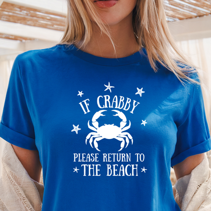 Person wearing a royal blue t-shirt with a crab graphic and text.
