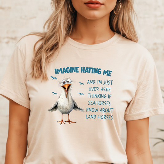 Person wearing a t-shirt with a cartoon seagull and humorous text.