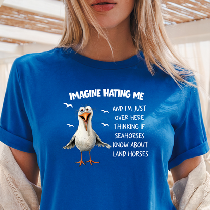 Person wearing a Royal blue t-shirt with a cartoon penguin and humorous text.