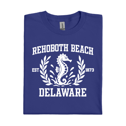 Folded cobalt blue t-shirt with white 'Rehoboth Beach, Delaware' design featuring a seahorse.