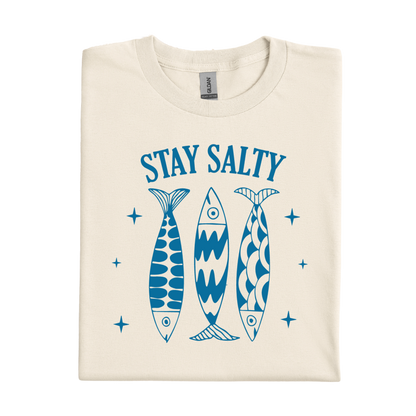 Natural colored t-shirt with blue fish illustrations and 'Stay Salty' text on a white background
