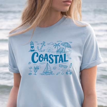 Person wearing a light blue t-shirt with coastal graphics and the word 'Coastal' in front of water.