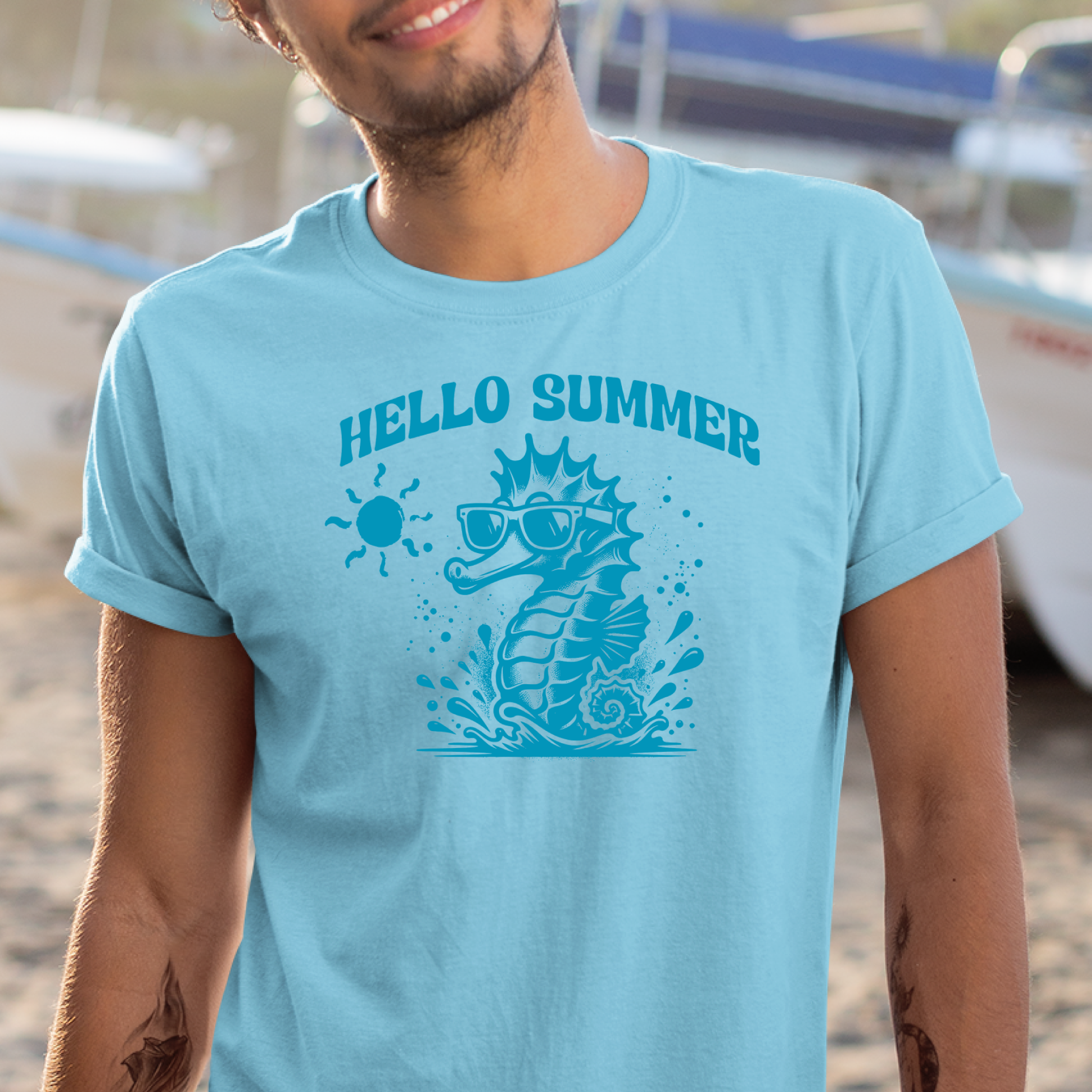 Gildan 5000 "Hello Summer" t shirt with a cute seahorse with sunglasses in one color graphics. Picture of a man standing in a ship yard wearing a t shirt.