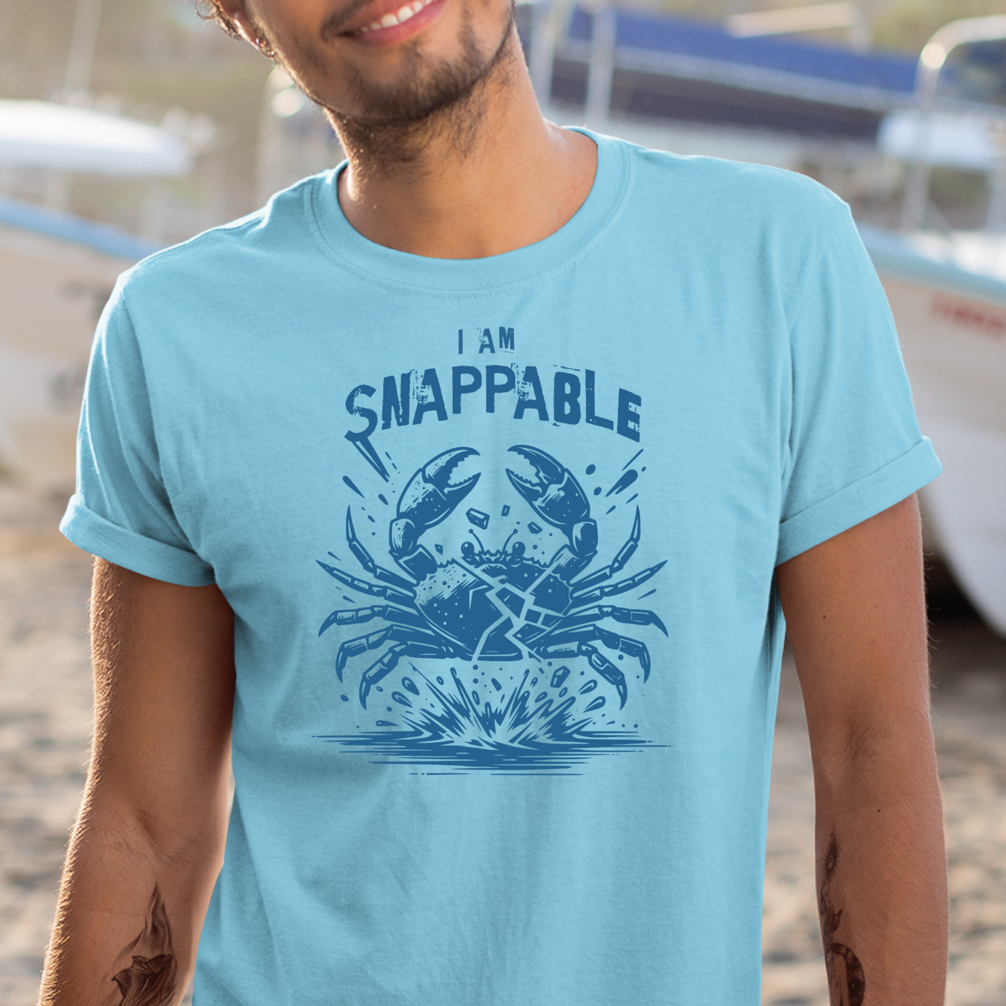 Gildan 5000 "I Am Snappable" t shirt with a crab cracked in half in a one color graphic. Picture of a man standing in a ship yard wearing a t shirt.