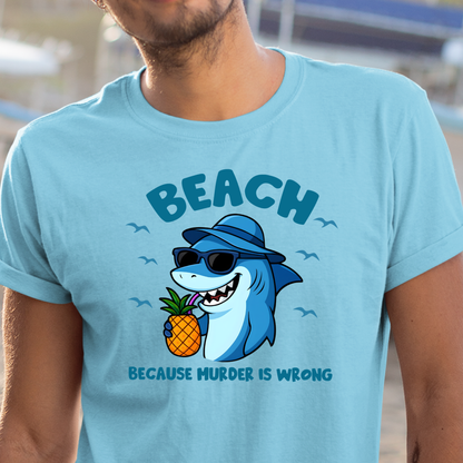 Light blue t-shirt with a shark holding a pineapple and 'BEACH BECAUSE MURDER IS WRONG' text.
