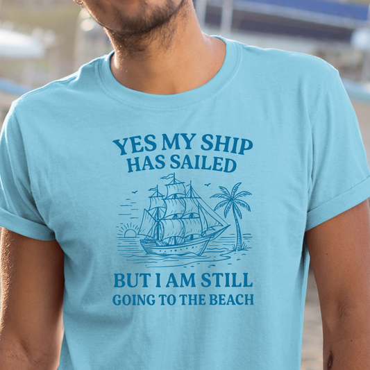Sky blue t-shirt with a ship graphic and text worn by a person.