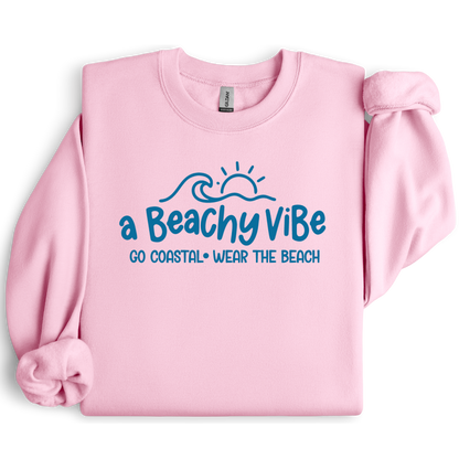 Pink sweatshirt with 'a Beachy Vibe' text design on a white background