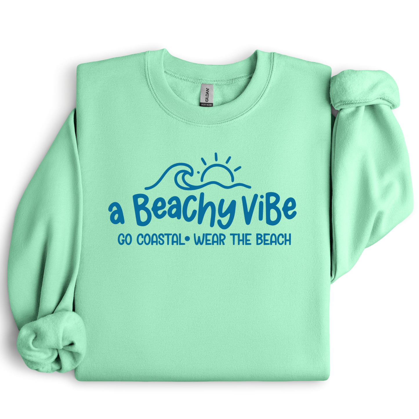 Mint green sweatshirt with 'a Beachy Vibe' text and graphics on a white background