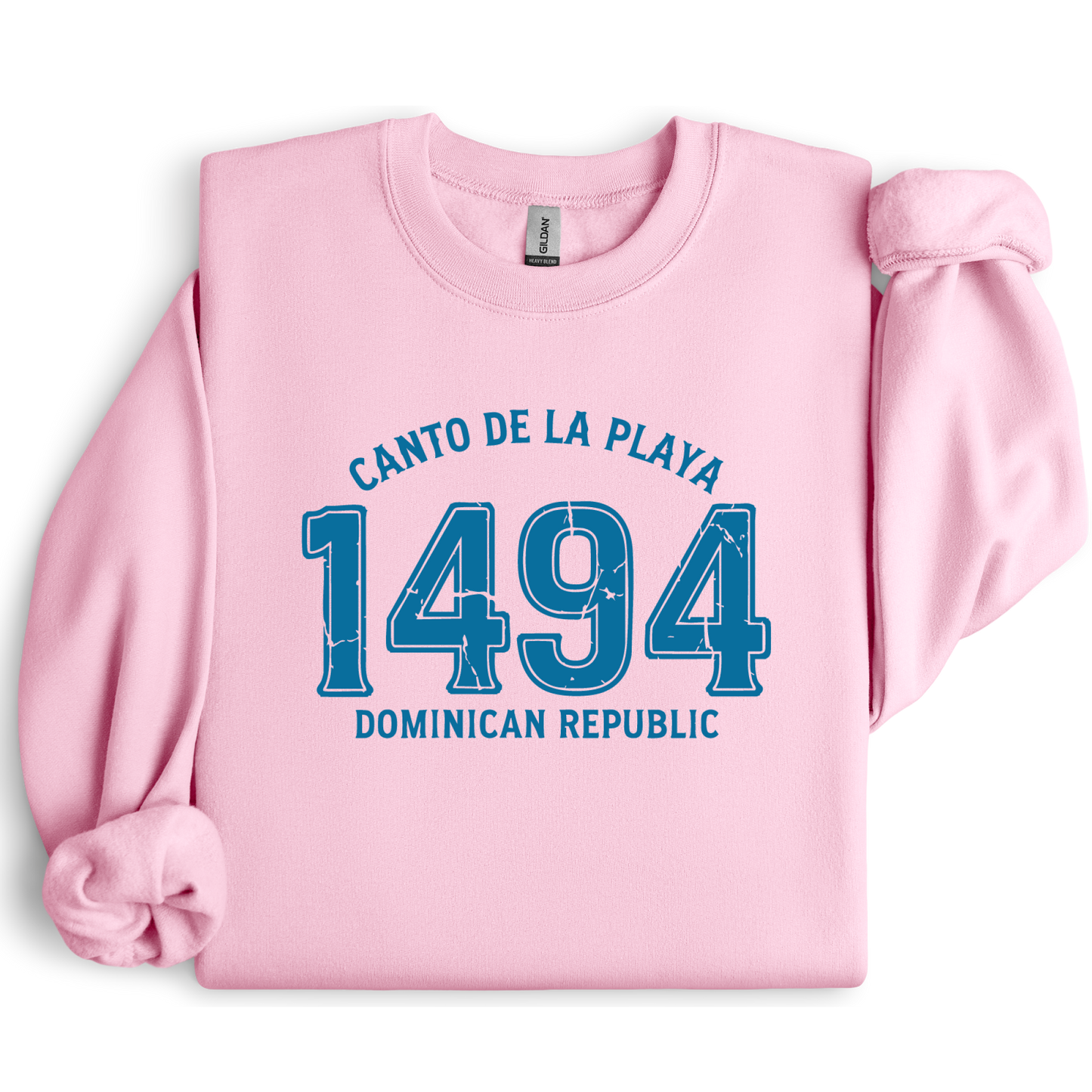 Gildan sweatshirt with “Canto De La Playa 1494 Dominican Republic” printed in distressed navy text. Vintage beach-inspired crewneck symbolizing Caribbean heritage and coastal charm. Made from soft cotton-poly blend fabric for comfort and style, ideal for beach lovers and travelers who adore Dominican culture. Cozy, sustainable, and perfect for casual wear or tropical getaways.