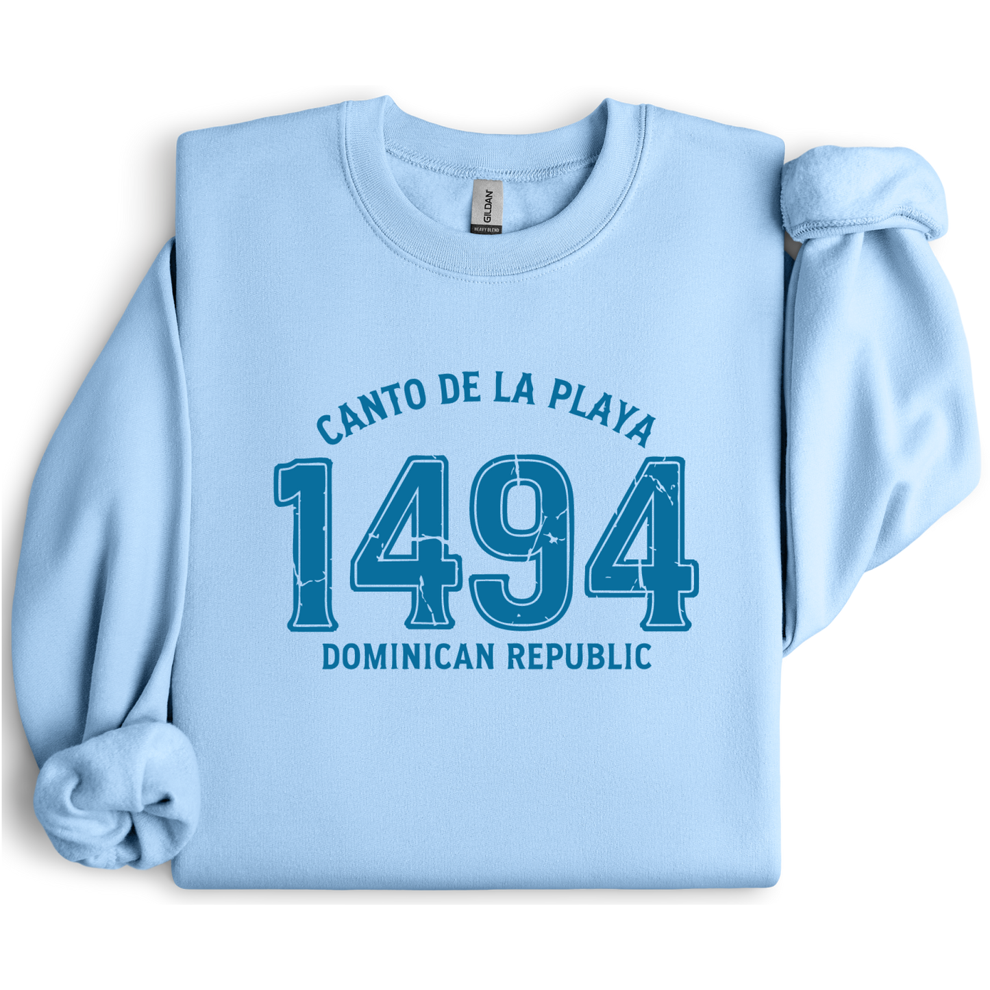Gildan sweatshirt with “Canto De La Playa 1494 Dominican Republic” printed in distressed navy text. Vintage beach-inspired crewneck symbolizing Caribbean heritage and coastal charm. Made from soft cotton-poly blend fabric for comfort and style, ideal for beach lovers and travelers who adore Dominican culture. Cozy, sustainable, and perfect for casual wear or tropical getaways.