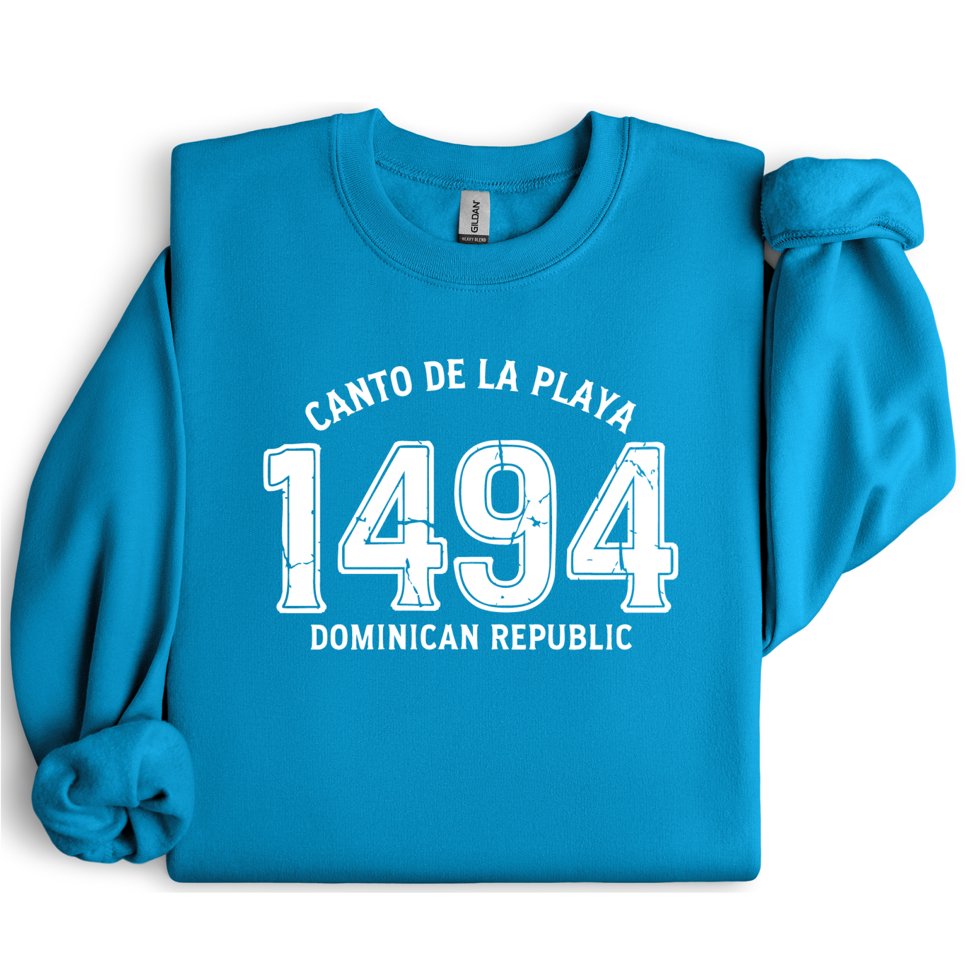 Gildan sweatshirt with “Canto De La Playa 1494 Dominican Republic” printed in distressed navy text. Vintage beach-inspired crewneck symbolizing Caribbean heritage and coastal charm. Made from soft cotton-poly blend fabric for comfort and style, ideal for beach lovers and travelers who adore Dominican culture. Cozy, sustainable, and perfect for casual wear or tropical getaways.